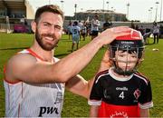 29 November 2019; Antrim's Neil McManus of 2019 PwC All-Star with seven year old Daithi Walsh during a coaching session before the PwC All Star Hurling Tour 2019 All Star game at Zayed Sport City in Abu Dhabi, United Arab Emirates. Photo by Ray McManus/Sportsfile