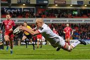 29 November 2019; Matt Faddes of Ulster dives over to score his side's first try during the Guinness PRO14 Round 7 match between Ulster and Scarlets at the Kingspan Stadium in Belfast. Photo by Ramsey Cardy/Sportsfile