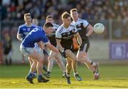 1 December 2019; Jerome Johnston of Kilcoo in action against Ultan Doherty of Naomh Conaill during the AIB Ulster GAA Football Senior Club Championship Final match between Kilcoo and Naomh Conaill at Healy Park in Omagh, Tyrone. Photo by Oliver McVeigh/Sportsfile