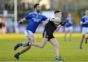 1 December 2019; Jerome Johnston of Kilcoo in action against Marty Boyle of Naomh Conaill during the AIB Ulster GAA Football Senior Club Championship Final match between Kilcoo and Naomh Conaill at Healy Park in Omagh, Tyrone. Photo by Oliver McVeigh/Sportsfile