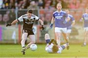1 December 2019; Darryl Brannigan of Kilcoo shoots to score his side's third goal past the Naomh Conaill goalkeeper Stephen McGrath during the AIB Ulster GAA Football Senior Club Championship Final match between Kilcoo and Naomh Conaill at Healy Park in Omagh, Tyrone. Photo by Oliver McVeigh/Sportsfile
