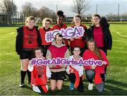 4 December 2019; Players from Scoil Chiarain, Glasnevin, and Scoil Eoin, Crumlin, Dublin, come together for a team photograph during the FAI Getting Girls Active Programme at Crumlin United, Windmill Road, Dublin. Photo by Seb Daly/Sportsfile