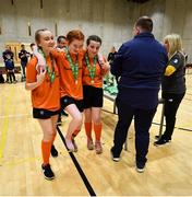 5 December 2019; Sorcha Doherty of Scoil Mhuire Secondary School, Buncrana, Co Donegal who sustained an injury is helped to get her medal by team-mates Aine Jordan, left, and Amy McBride Duncan following the FAI Post Primary Schools Futsal National Finals in the WIT Arena, Waterford United. Photo by David Fitzgerald/Sportsfile