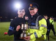 6 December 2019; Assistant An Garda Síochána Commissioner for Dublin Pat Leahy presents the trophy to Baldoyle captain Luke Corrigan during the Late Nite League Finals at Irishtown Stadium in Dublin. Photo by Harry Murphy/Sportsfile
