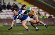 7 December 2019; John O'Loughlin of Laois in action against Eoin Carroll of Offaly during the 2020 O'Byrne Cup Round 1 match between Laois and Offaly at McCann Park in Portarlington, Co Laois. Photo by Harry Murphy/Sportsfile