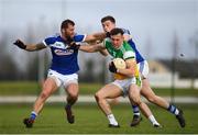 7 December 2019; Jordan Hayes of Offaly in action against Jason Moore, left, and Diarmuid Whelan of Laois during the 2020 O'Byrne Cup Round 1 match between Laois and Offaly at McCann Park in Portarlington, Co Laois. Photo by Harry Murphy/Sportsfile