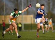 7 December 2019; Evan O'Carroll of Laois in action against Cian Donohoe of Offaly during the 2020 O'Byrne Cup Round 1 match between Laois and Offaly at McCann Park in Portarlington, Co Laois. Photo by Harry Murphy/Sportsfile