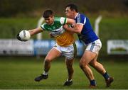 7 December 2019; Cathal Mangan of Offaly in action against John O'Loughlin of Laois during the 2020 O'Byrne Cup Round 1 match between Laois and Offaly at McCann Park in Portarlington, Co Laois. Photo by Harry Murphy/Sportsfile