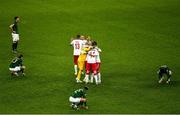 18 November 2019; Denmark players celebrate as Republic of Ireland players, from left, Enda Stevens, Jeff Hendrick, Matt Doherty and Sean Maguire are dejected during the UEFA EURO2020 Qualifier match between Republic of Ireland and Denmark at the Aviva Stadium in Dublin. Photo by Ray McManus/Sportsfile