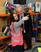 8 December 2019; Republic of Ireland manager Mick McCarthy was on hand today to hand over Republic of Ireland bags filled with jerseys, footballs, scarfs & other merchandise to St Vincent De Paul staff, at the St Vincent De Paul depot on Sean McDermott Street, Summerhill, Dublin. The gifts are part of an annual Christmas donation for families in need. Pictured are Republic of Ireland manager Mick McCarthy and Lauren Buckley, Corporate Volunteer from Electric Ireland, at the St Vincent De Paul depot on Sean McDermott Street, Summerhill, Dublin. Photo by Seb Daly/Sportsfile