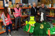 8 December 2019; Republic of Ireland manager Mick McCarthy was on hand today to hand over Republic of Ireland bags filled with jerseys, footballs, scarfs & other merchandise to Liam Casey, East Region President, St Vincent De Paul, at the St Vincent De Paul depot on Sean McDermott Street, Summerhill, Dublin. The gifts are part of an annual Christmas donation for families in need. Pictured are Republic of Ireland manager Mick McCarthy, Liam Casey, East Region President, St Vincent De Paul, and corporate volunteers from Electric Ireland, at the St Vincent De Paul depot on Sean McDermott Street, Summerhill, Dublin. Photo by Seb Daly/Sportsfile