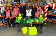 8 December 2019; Republic of Ireland manager Mick McCarthy was on hand today to hand over Republic of Ireland bags filled with jerseys, footballs, scarfs & other merchandise to Liam Casey, centre, East Region President, St Vincent De Paul, at the St Vincent De Paul depot on Sean McDermott Street, Summerhill, Dublin. The gifts are part of an annual Christmas donation for families in need. Pictured are Republic of Ireland manager Mick McCarthy, Liam Casey, East Region President, St Vincent De Paul, and corporate volunteers from Electric Ireland, at the St Vincent De Paul depot on Sean McDermott Street, Summerhill, Dublin. Photo by Seb Daly/Sportsfile