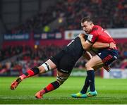 7 December 2019; JJ Hanrahan of Munster is tackled by Ben Earl of Saracens during the Heineken Champions Cup Pool 4 Round 3 match between Munster and Saracens at Thomond Park in Limerick. Photo by Seb Daly/Sportsfile