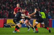 7 December 2019; Rory Scannell of Munster is tackled by Ben Spencer, left, and Manu Vunipola of Saracens during the Heineken Champions Cup Pool 4 Round 3 match between Munster and Saracens at Thomond Park in Limerick. Photo by Brendan Moran/Sportsfile