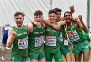 8 December 2019; The Ireland Men's U20 team, from left, Thomas McStay, Jamie Battle, Daragh McElhinney, Keelan Kilrehill, and Efrem Gidey celebrate winning a medal after competing in the Men's U20 event during the European Cross Country Championships 2019 at Bela Vista Park in Lisbon, Portugal. Photo by Sam Barnes/Sportsfile