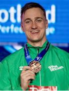 8 December 2019; Shane Ryan of Ireland showing his bronze medal of the Men’s 50m Backstroke during day five of the European Short Course Swimming Championships 2019 at Tollcross International Swimming Centre in Glasgow, Scotland. Photo by Joseph Kleindl/Sportsfile