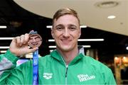 9 December 2019; Shane Ryan of Ireland with his bronze medal, from the Men’s 50m Backstroke, on his return from the European Short Course Swimming Championships 2019 in Scotland at Dublin Airport in Dublin. Photo by Piaras Ó Mídheach/Sportsfile