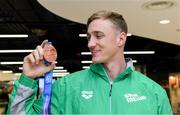 9 December 2019; Shane Ryan of Ireland with his bronze medal, from the Men’s 50m Backstroke, on his return from the European Short Course Swimming Championships 2019 in Scotland at Dublin Airport in Dublin. Photo by Piaras Ó Mídheach/Sportsfile