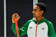 9 December 2019; Efrem Gidey of Ireland poses for a portrait with his bronze medal in the U20 Men's event during the Ireland European Cross Country Team Homecoming at Dublin Airport in Dublin. Photo by Piaras Ó Mídheach/Sportsfile