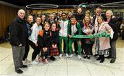 9 December 2019; Efrem Gidey of Ireland poses for a portrait with his bronze medal in the U20 Men's event with members of Clonliffe Harriers during the Ireland European Cross Country Team Homecoming at Dublin Airport in Dublin. Photo by Piaras Ó Mídheach/Sportsfile