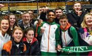 9 December 2019; Efrem Gidey of Ireland poses for a portrait with his bronze medal in the U20 Men's event with members of Clonliffe Harriers during the Ireland European Cross Country Team Homecoming at Dublin Airport in Dublin. Photo by Piaras Ó Mídheach/Sportsfile