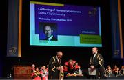 11 December 2019; Former Dublin football manager Jim Gavin signs the Roll of Honour alongside Dr Martin McAleese, Chancellor of Dublin City University, left, and Professor Brian MacCraith, President of DCU, as Gavin was conferred with the Doctorate of Philosophy by DCU at the Helix, DCU, in Dublin. Photo by Piaras Ó Mídheach/Sportsfile