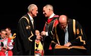 11 December 2019; Former Dublin football manager Jim Gavin shakes hands with Dr Martin McAleese, Chancellor of Dublin City University, as Professor Brian MacCraith, President of DCU, signs the Roll of Honour as Gavin was conferred with the Doctorate of Philosophy by DCU at the Helix, DCU, in Dublin. Photo by Piaras Ó Mídheach/Sportsfile