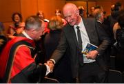 11 December 2019; Former Dublin football manager Jim Gavin is congratuled by Kilkenny hurling manager Brian Cody at his conferring with the Doctorate of Philosophy by DCU at the Helix, DCU, in Dublin. Photo by Piaras Ó Mídheach/Sportsfile