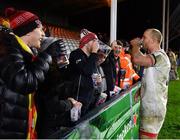 13 December 2019; Matt Faddes of Ulster shares a drink with a supporter following his side's victory during the Heineken Champions Cup Pool 3 Round 4 match between Harlequins and Ulster at Twickenham Stoop in London, England. Photo by Seb Daly/Sportsfile