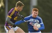 14 December 2019; Colm Murphy of Laois in action against Jim Rossiter of Wexford during the 2020 O'Byrne Cup Round 2 match between Wexford and Laois at St Patrick's Park in Enniscorthy, Wexford. Photo by Eóin Noonan/Sportsfile