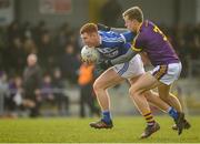 14 December 2019; Colm Murphy of Laois in action against Jim Rossiter of Wexford during the 2020 O'Byrne Cup Round 2 match between Wexford and Laois at St Patrick's Park in Enniscorthy, Wexford. Photo by Eóin Noonan/Sportsfile
