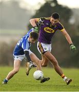 14 December 2019; Alan Kinsella of Laois is tackled by Glen Malone of Wexford during the 2020 O'Byrne Cup Round 2 match between Wexford and Laois at St Patrick's Park in Enniscorthy, Wexford. Photo by Eóin Noonan/Sportsfile