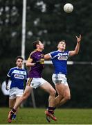 14 December 2019; John O'Loughlin of Laois in action against Colm Feeney of Wexford during the 2020 O'Byrne Cup Round 2 match between Wexford and Laois at St Patrick's Park in Enniscorthy, Wexford. Photo by Eóin Noonan/Sportsfile