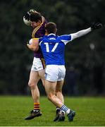 14 December 2019; Tom Byrne of Wexford is tackled by Trevor Collins of Laois during the 2020 O'Byrne Cup Round 2 match between Wexford and Laois at St Patrick's Park in Enniscorthy, Wexford. Photo by Eóin Noonan/Sportsfile