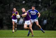 14 December 2019; Martin O'Connor of Wexford is tackled by Robert Pigott of Laois during the 2020 O'Byrne Cup Round 2 match between Wexford and Laois at St Patrick's Park in Enniscorthy, Wexford. Photo by Eóin Noonan/Sportsfile