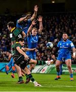 14 December 2019; James Mitchell of Northampton Saints attempts a box kick despite the efforts of  Scott Fardy, left, and Ciarán Frawley of Leinster during the Heineken Champions Cup Pool 1 Round 4 match between Leinster and Northampton Saints at the Aviva Stadium in Dublin. Photo by Sam Barnes/Sportsfile
