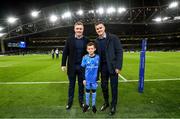 14 December 2019; Mascot 10 year old Jamie Winston, from Greystones, Co. Wicklow, with Leinster players Dan Leavy and Jonathan Sexton at the Heineken Champions Cup Pool 1 Round 4 match between Leinster and Northampton Saints at the Aviva Stadium in Dublin. Photo by Ramsey Cardy/Sportsfile