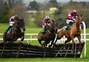 15 December 2019; Run Wild Fred, right, with Jack Kennedy up, jumps the last, alongside eventual second place Joshua Webb, centre, with Sean Flanagan up, and eventual third place Last Minute Man, with Keith Donoghue up, on their way to winning the John Lynch Carpets Maiden Hurdle at Navan Racecourse in Navan, Meath. Photo by Seb Daly/Sportsfile