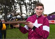28 December 2019; Jack Kennedy with the trophy after riding Apple's Jade to winning the Frank Ward Memorial Hurdle during Day Three of the Leopardstown Christmas Festival 2019 at Leopardstown Racecourse in Dublin. Photo by Harry Murphy/Sportsfile