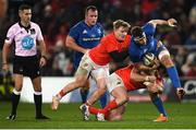 28 December 2019; Caelan Doris of Leinster is tackled by Chris Cloete, left, and Dave Kilcoyne of Munster during the Guinness PRO14 Round 9 match between Munster and Leinster at Thomond Park in Limerick. Photo by Ramsey Cardy/Sportsfile