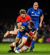 28 December 2019; Rowan Osborne of Leinster is tackled by Chris Cloete, left, and Billy Holland of Munster during the Guinness PRO14 Round 9 match between Munster and Leinster at Thomond Park in Limerick. Photo by Ramsey Cardy/Sportsfile