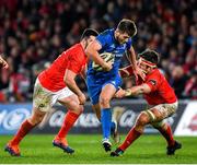 28 December 2019; Ross Byrne of Leinster beats the tackle by Billy Holland of Munster during the Guinness PRO14 Round 9 match between Munster and Leinster at Thomond Park in Limerick. Photo by Ramsey Cardy/Sportsfile