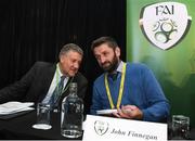 29 December 2019; FAI lead executive Paul Cooke, left, in conversation with board member John Finnegan during the FAI Annual General Meeting at the Citywest Hotel in Dublin. Photo by Ramsey Cardy/Sportsfile