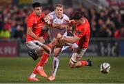 3 January 2020; Will Addison of Ulster kicks under pressure from Conor Murray and Jack O'Donoghue of Munster during the Guinness PRO14 Round 10 match between Ulster and Munster at Kingspan Stadium in Belfast. Photo by Harry Murphy/Sportsfile