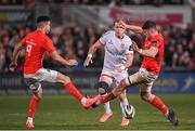 3 January 2020; Will Addison of Ulster kicks under pressure from Conor Murray and Jack O'Donoghue of Munster during the Guinness PRO14 Round 10 match between Ulster and Munster at Kingspan Stadium in Belfast. Photo by Harry Murphy/Sportsfile