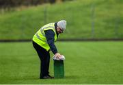 4 January 2020; Steward Benny Browne cleans the photo bench prior to the 2020 O'Byrne Cup Round 2 match between Meath and Laois at Pairc Tailteann in Navan, Meath. Photo by Harry Murphy/Sportsfile