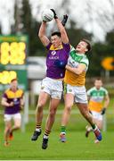 4 January 2020; Eoghan Nolan of Wexford in action against Michael Brazil of Offaly during the 2020 O'Byrne Cup Round 2 match between Offaly and Wexford at Faithful Fields in Kilcormac, Offaly. Photo by Matt Browne/Sportsfile