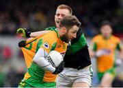 4 January 2020; Micheál Lundy of Corofin in action against Alan O'Donovan of Nemo Rangers during the AIB GAA Football All-Ireland Senior Club Championship semi-final match between Corofin and Nemo Rangers at Cusack Park in Ennis, Clare. Photo by Brendan Moran/Sportsfile