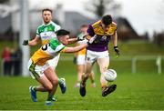 4 January 2020; Tom Byrne of Wexford in action against Ruairi McNamee of Offaly during the 2020 O'Byrne Cup Round 2 match between Offaly and Wexford at Faithful Fields in Kilcormac, Offaly. Photo by Matt Browne/Sportsfile