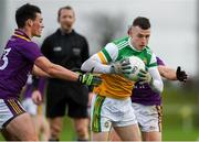 4 January 2020; Cian Farrell of Offaly in action against Robbie Brooks and Conor Carty Wexford during the 2020 O'Byrne Cup Round 2 match between Offaly and Wexford at Faithful Fields in Kilcormac, Offaly. Photo by Matt Browne/Sportsfile